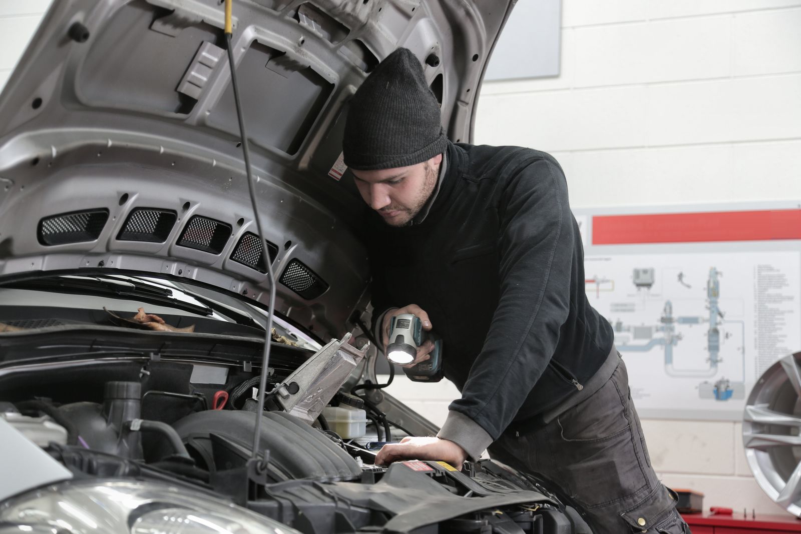 Technician repairing the front of a car